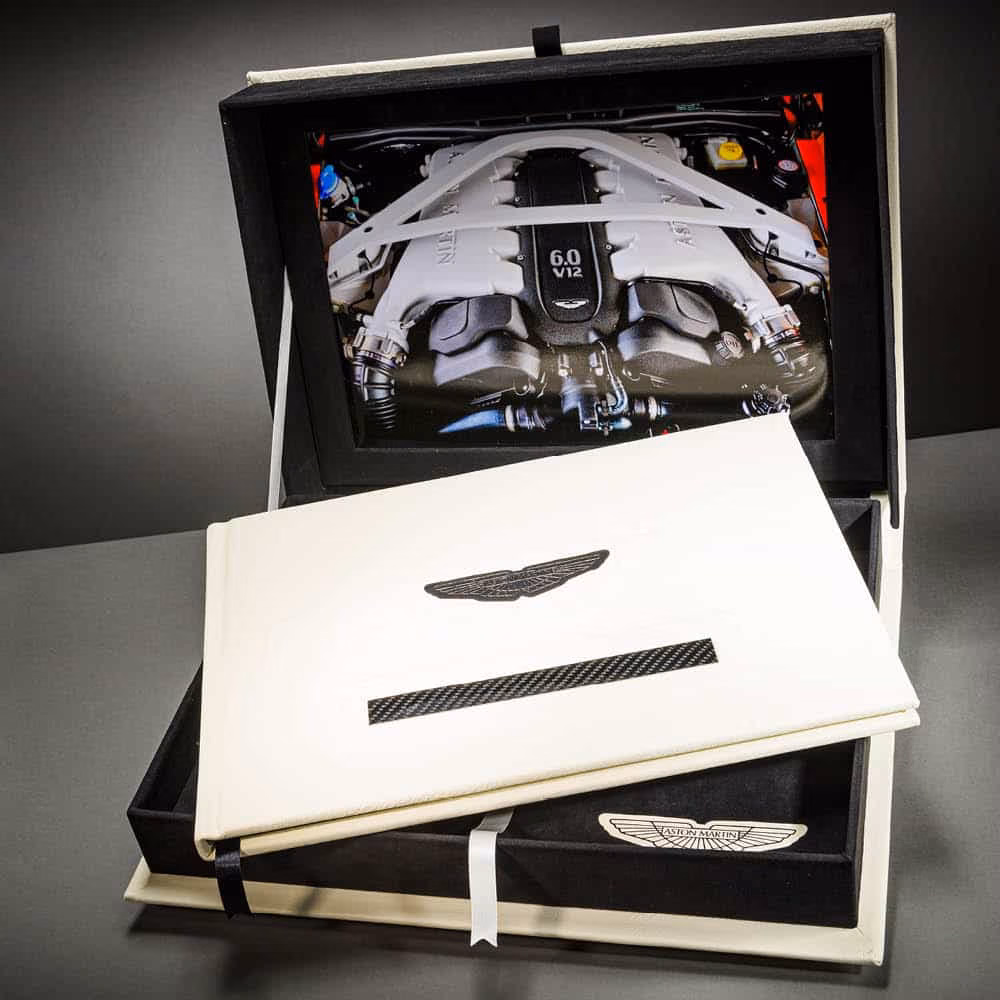 Aston Martin book and presentation box featuring an engine photograph
