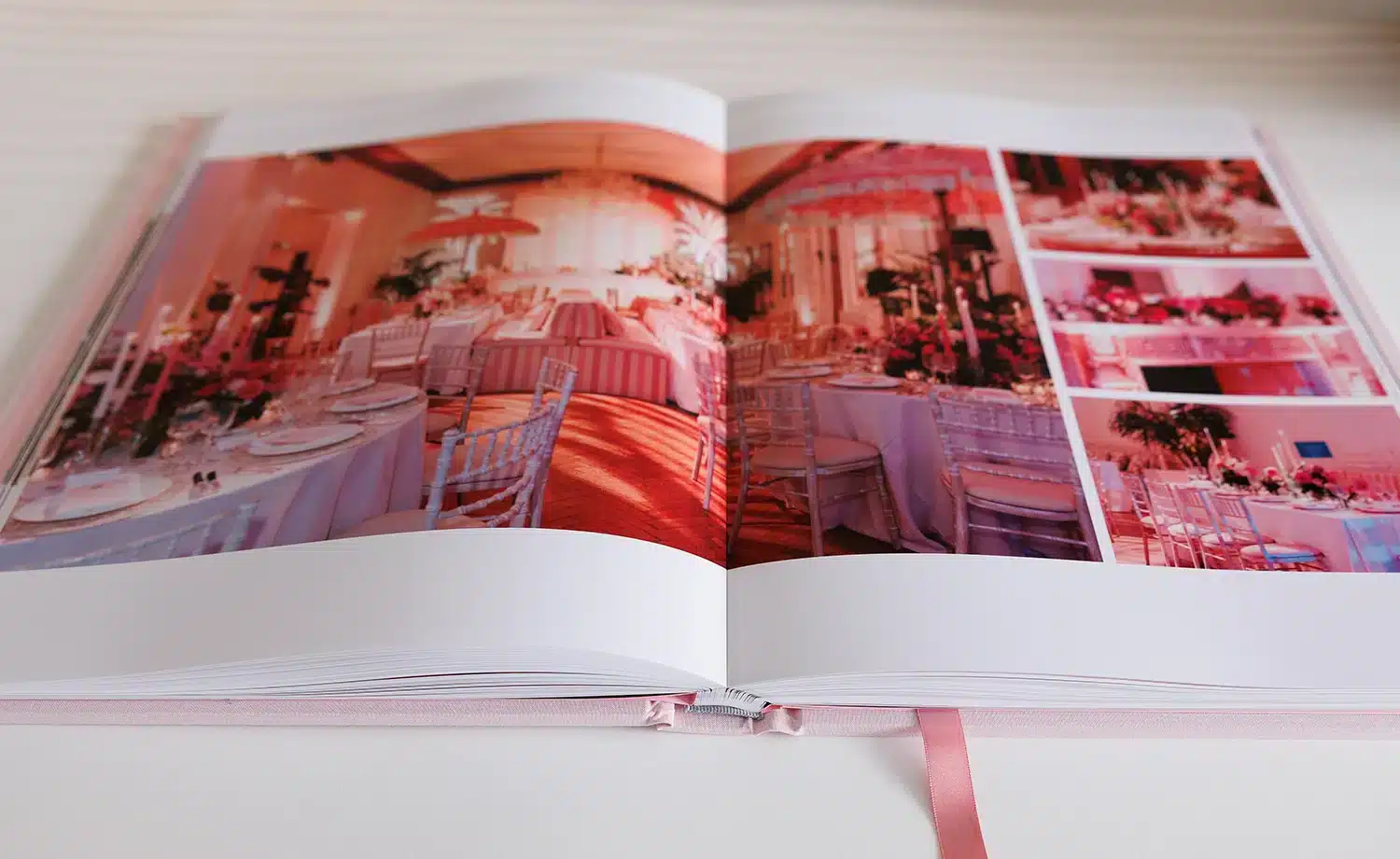 Wedding album opened to a reception venue spread