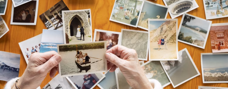 A family story book opened across a wide photographic spread