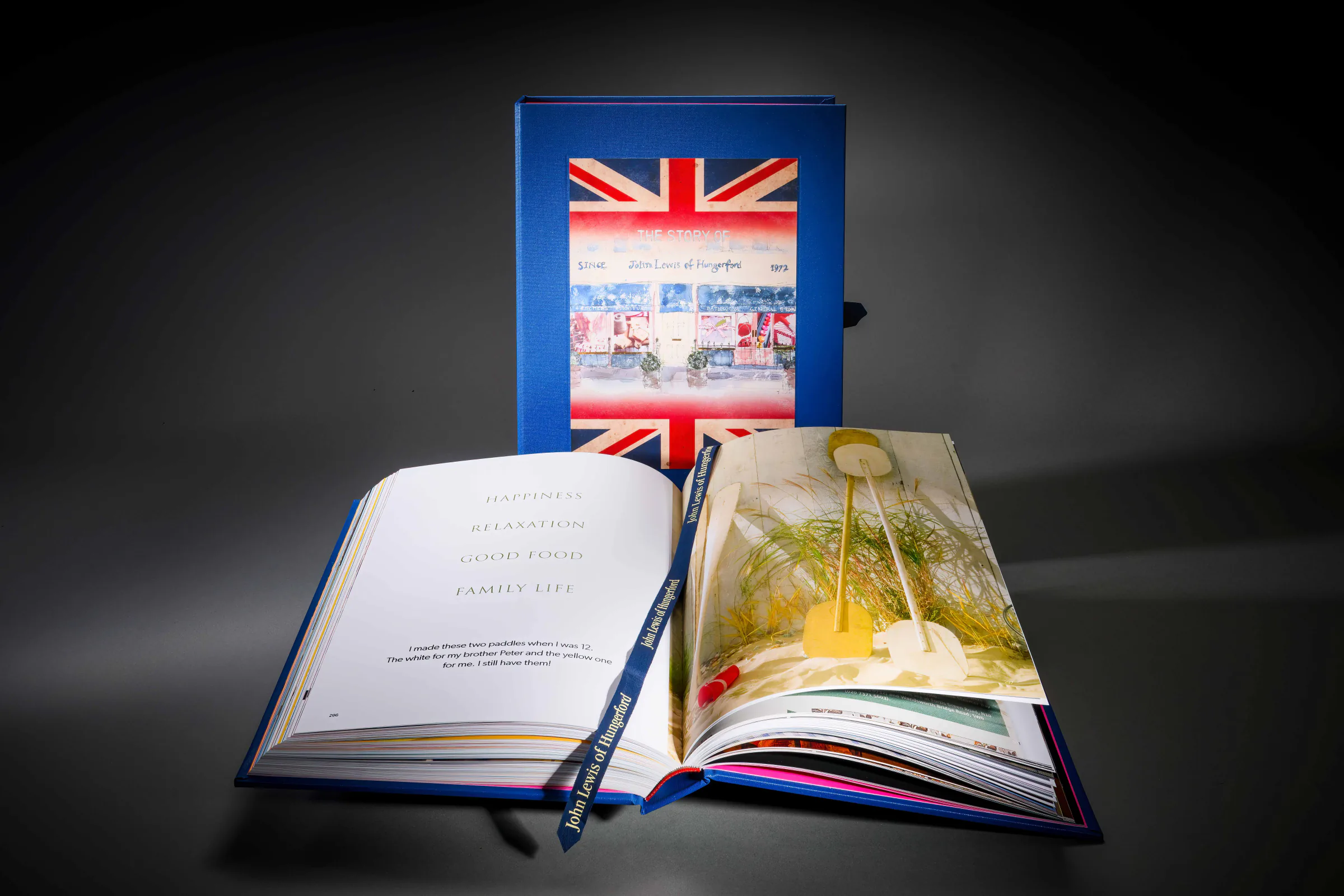 John Lewis family history presentation book with an open photographic spread
