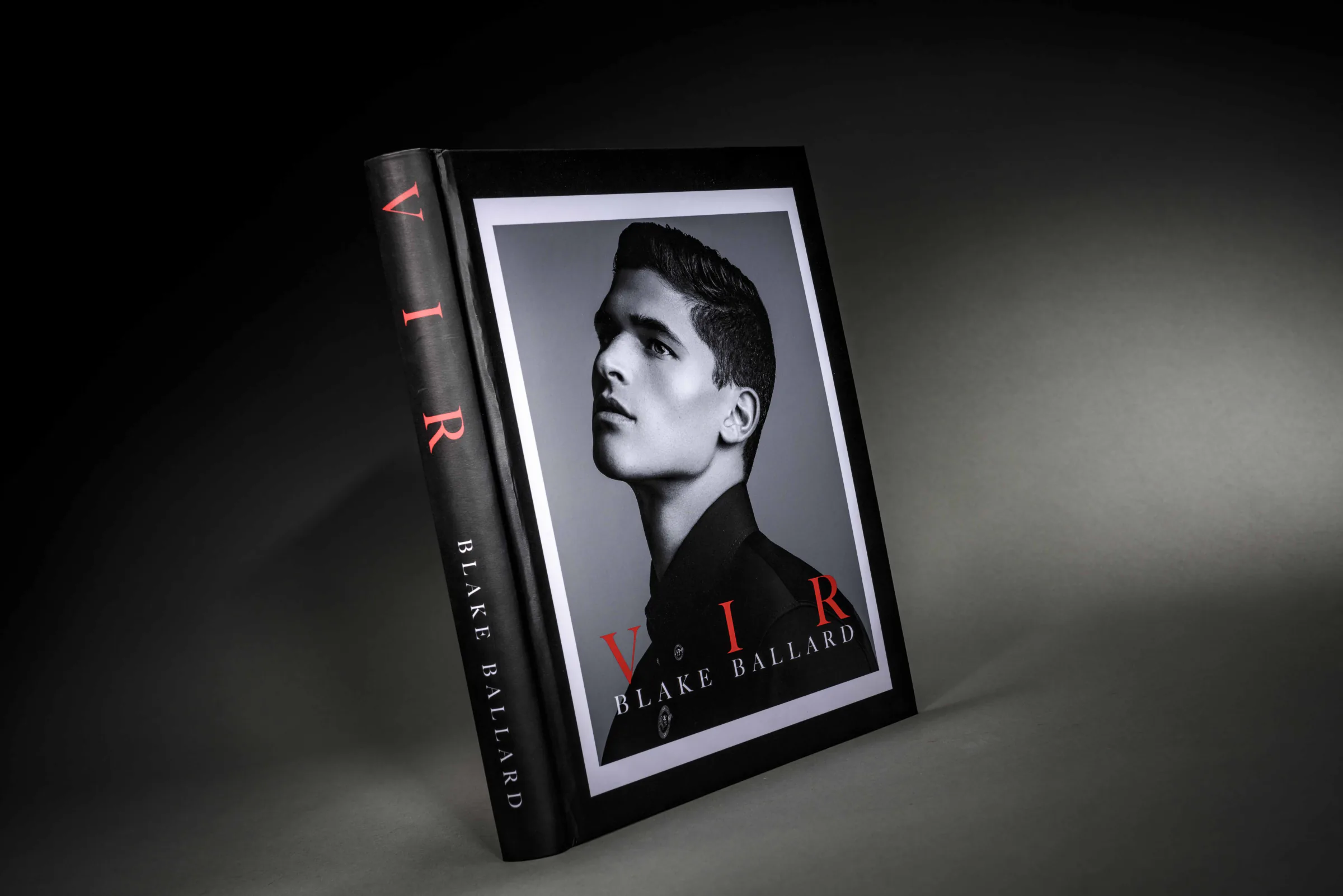Black fashion portfolio photo book featuring a monochrome portrait