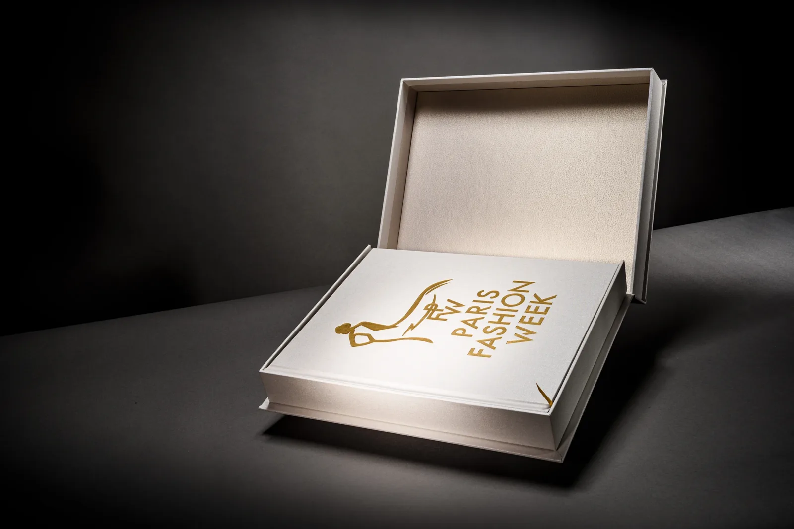 A pearl presentation case for Paris Fashion Week, blocked in gold foil