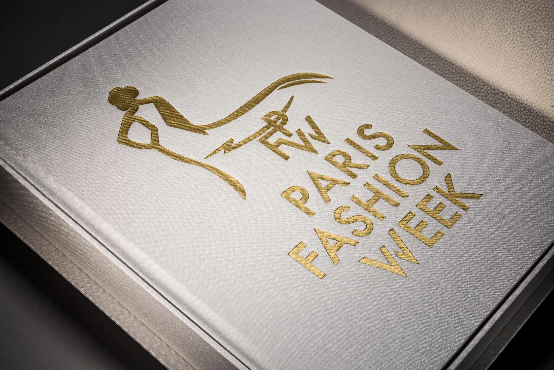 Pearl presentation book with gold Paris Fashion Week artwork