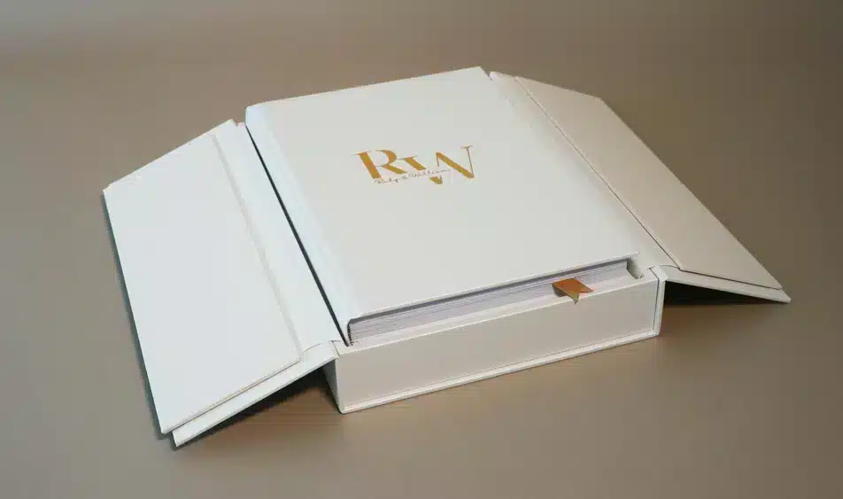 White personalised wedding album displayed in an open presentation box