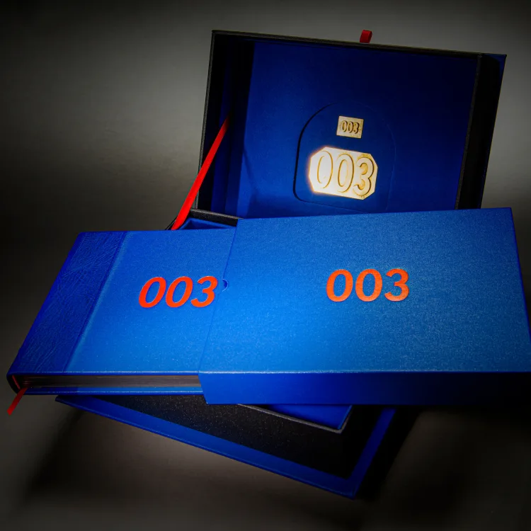 Blue James Bond 003 limited-edition books arranged with their presentation box