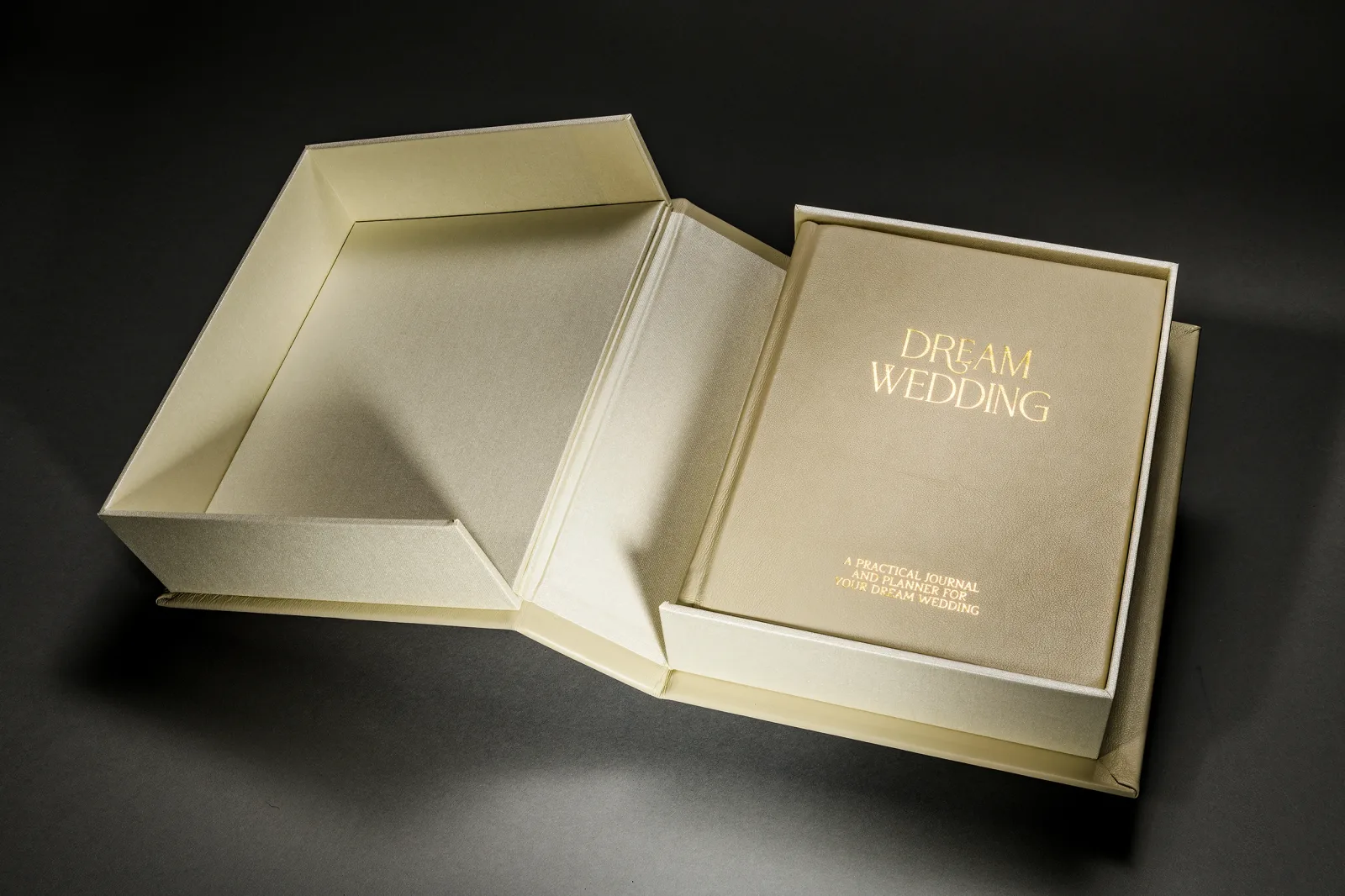 Gold Dream Wedding photo book beside its matching presentation box