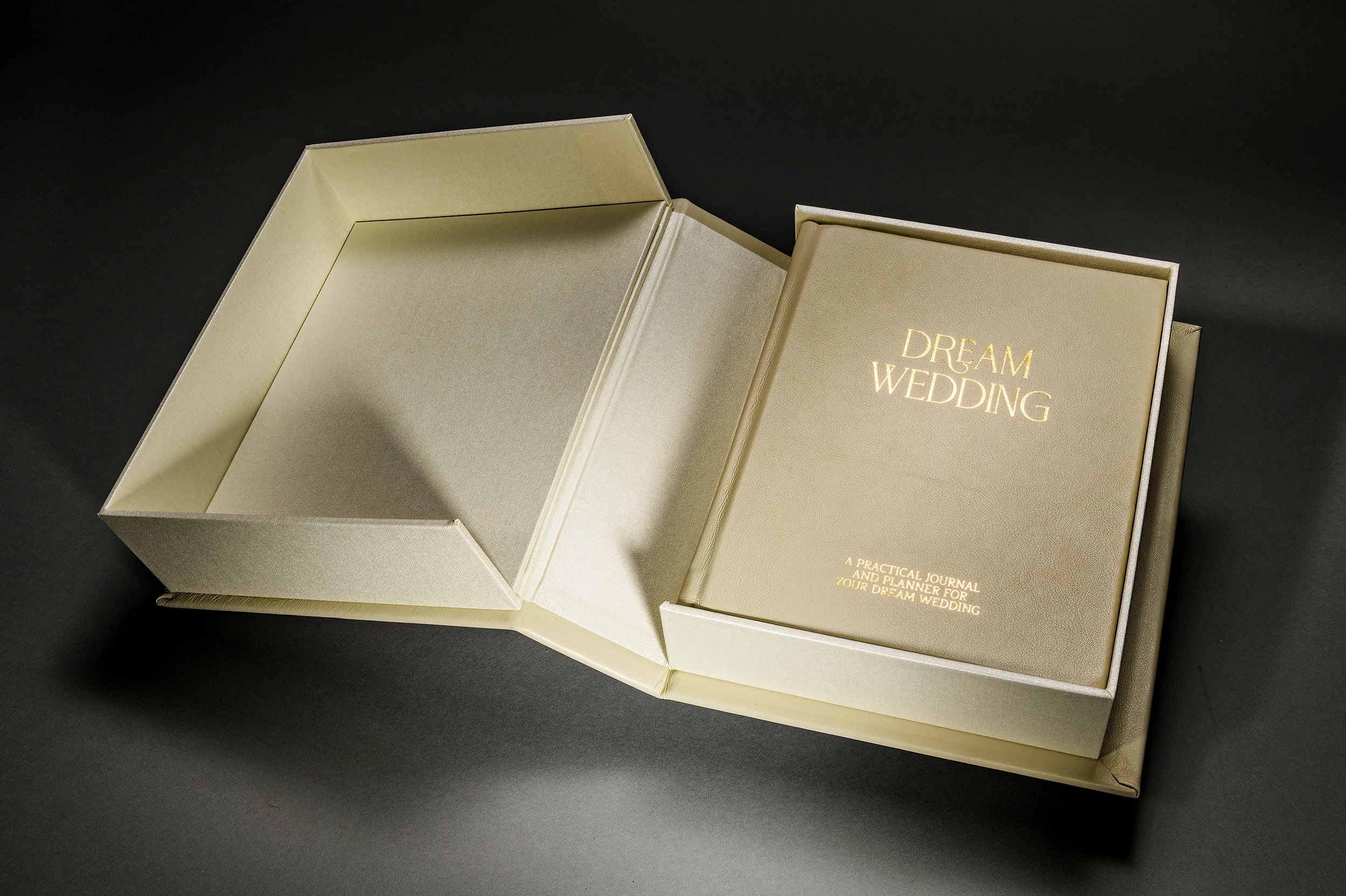 Gold Dream Wedding photo book beside its matching presentation box