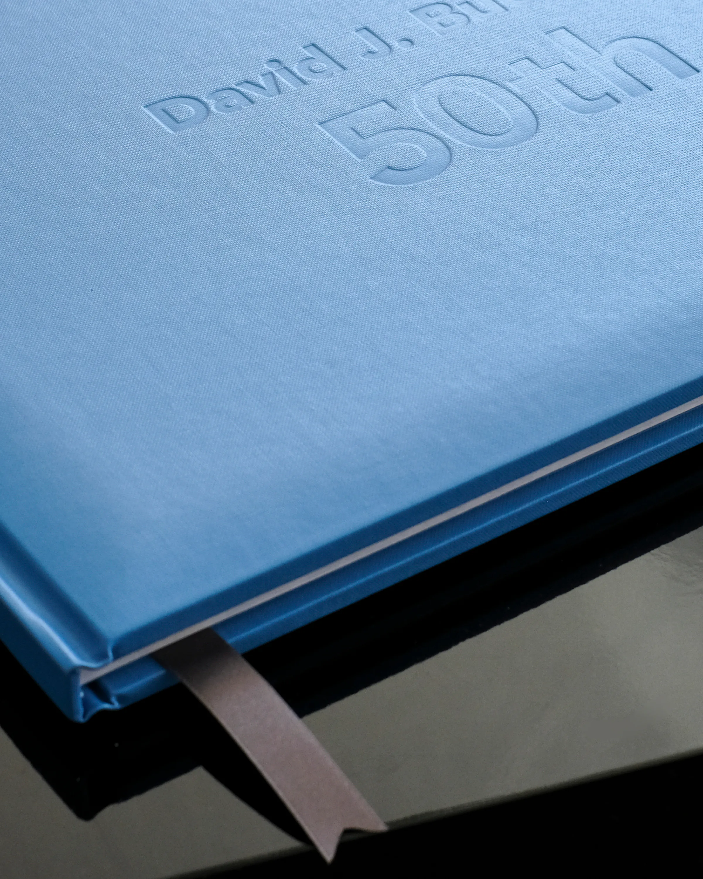 Personalised blue fiftieth birthday photo album with matching ribbon marker