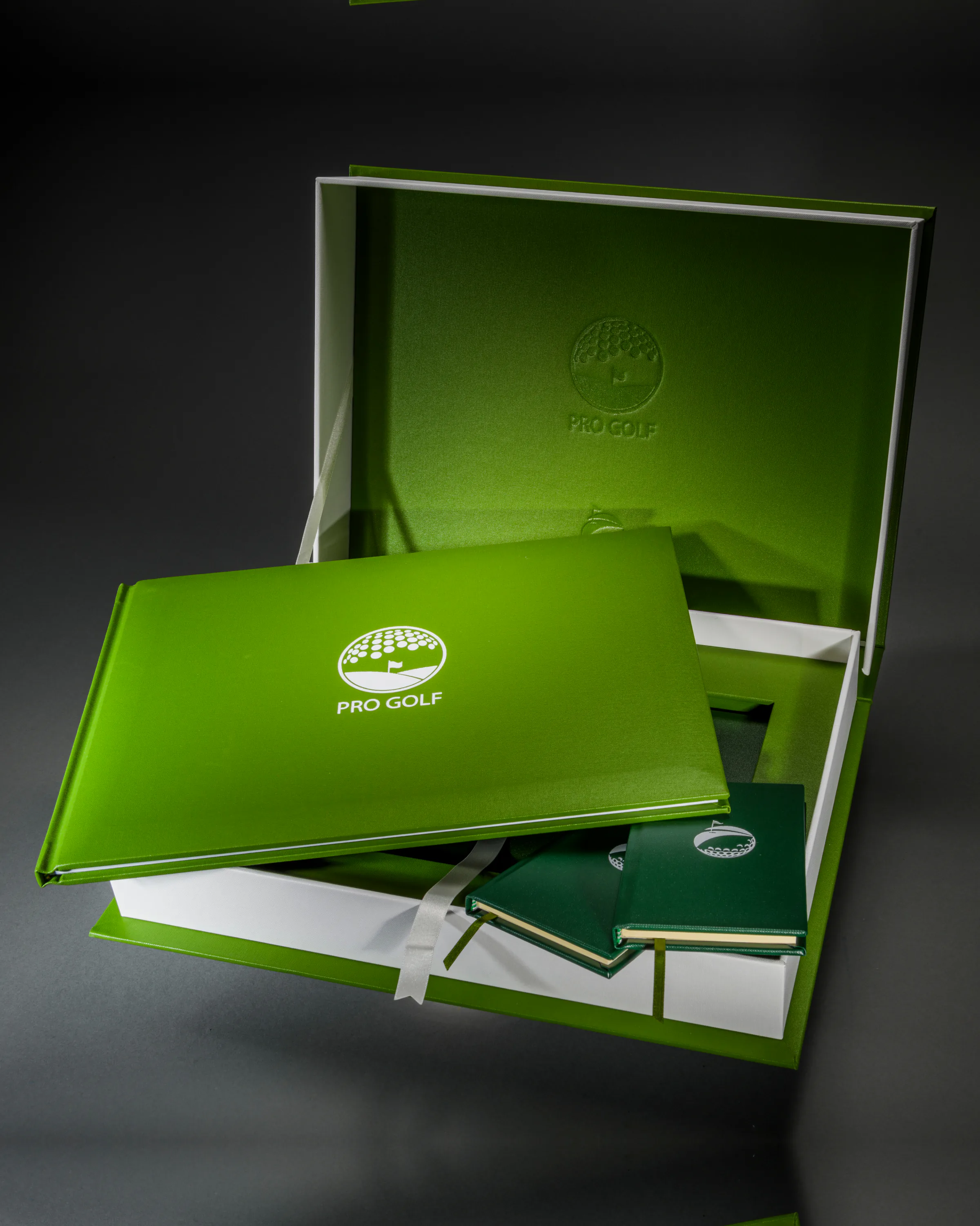 Green Pro Golf celebration book arranged with its matching presentation box