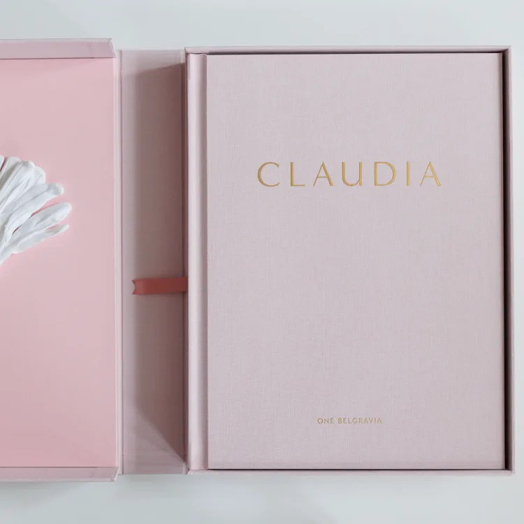 Pale pink Claudia celebration book inside its matching presentation box
