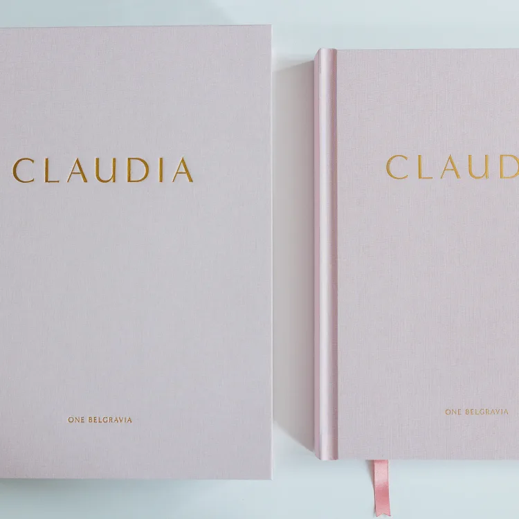 Two pale pink Claudia books personalised with gold foil lettering