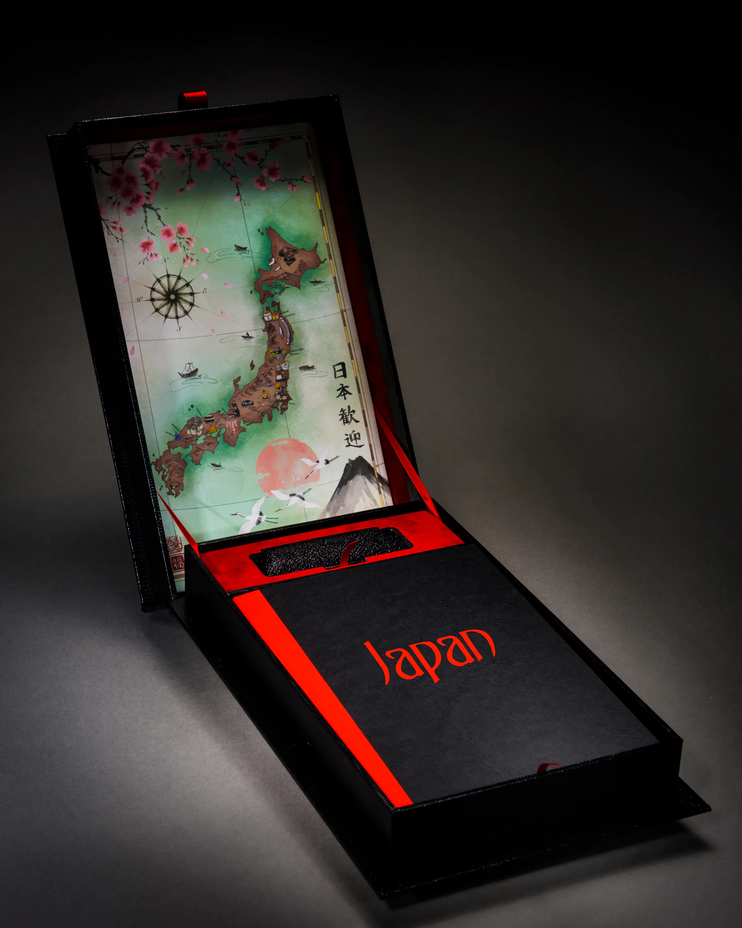 Japan travel book displayed inside a tall black and red presentation box