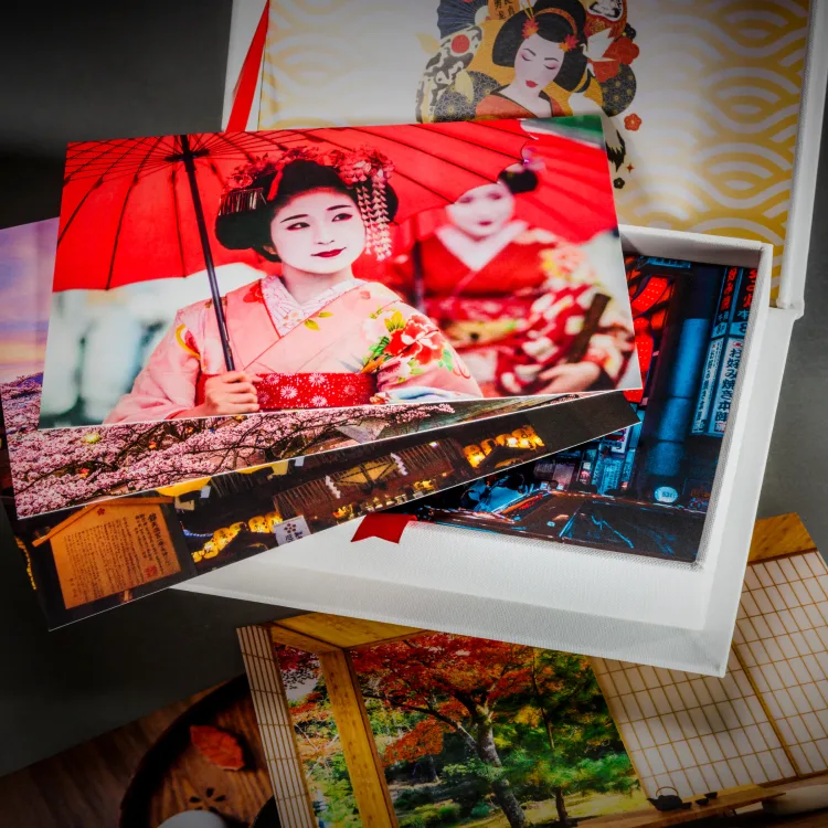 Japanese travel photo book and colourful prints arranged as a personal gift set