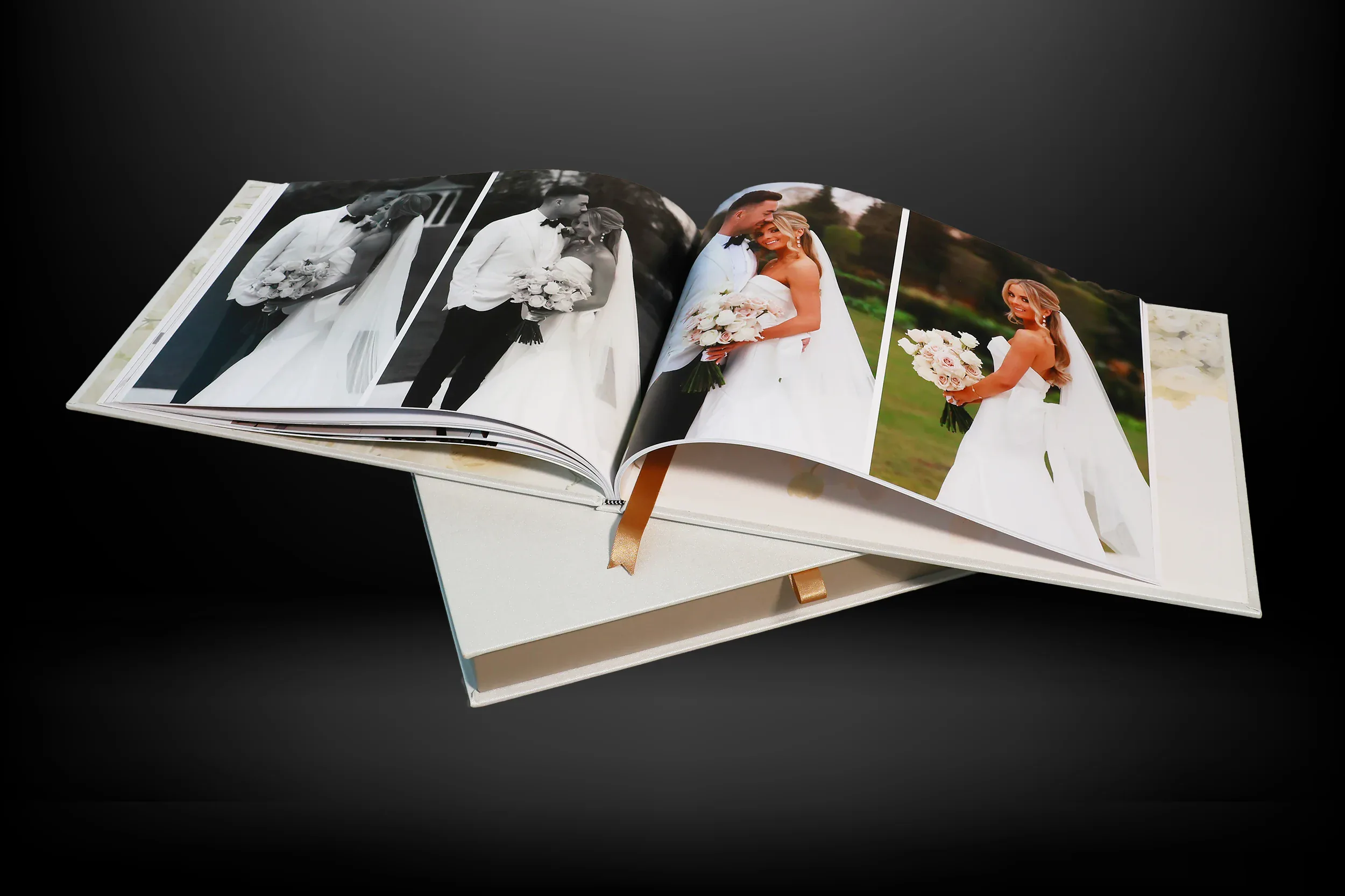 Open wedding photo book showing black-and-white and colour bridal portraits