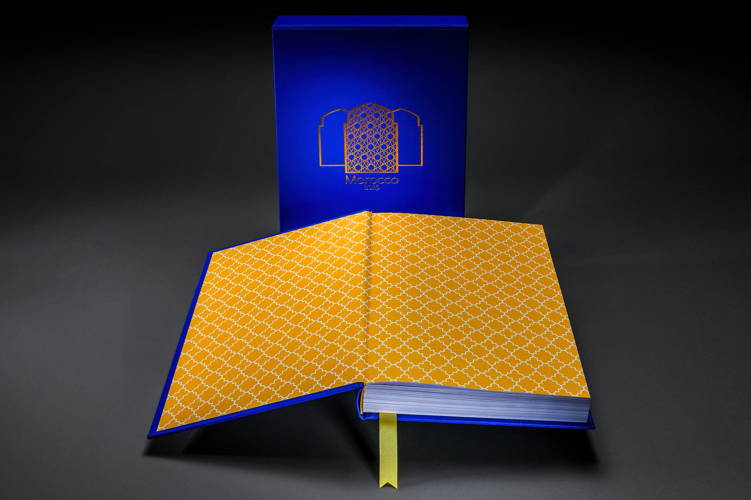 Open blue and orange photo book showing patterned endpapers