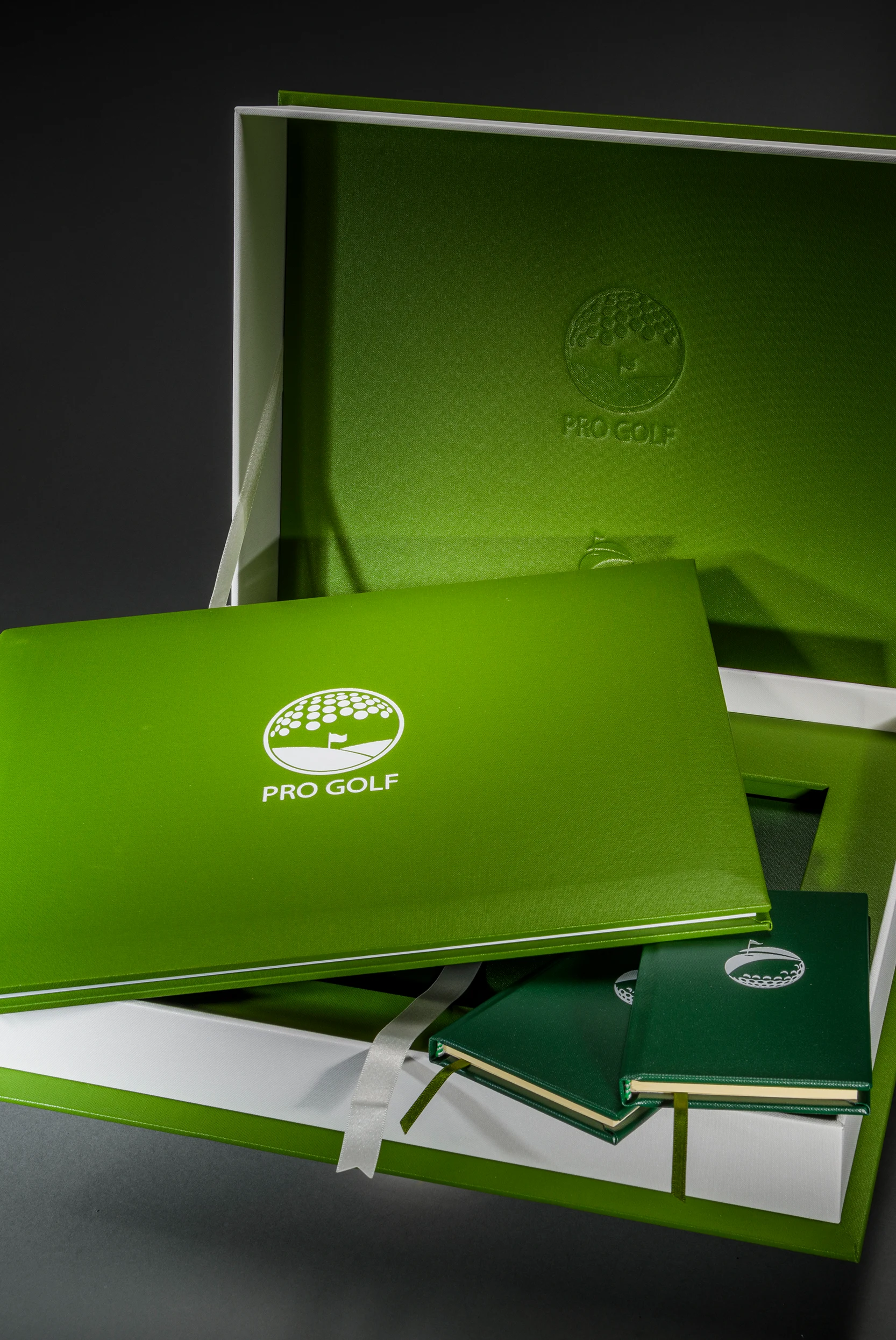 Green Pro Golf III book beside its presentation box