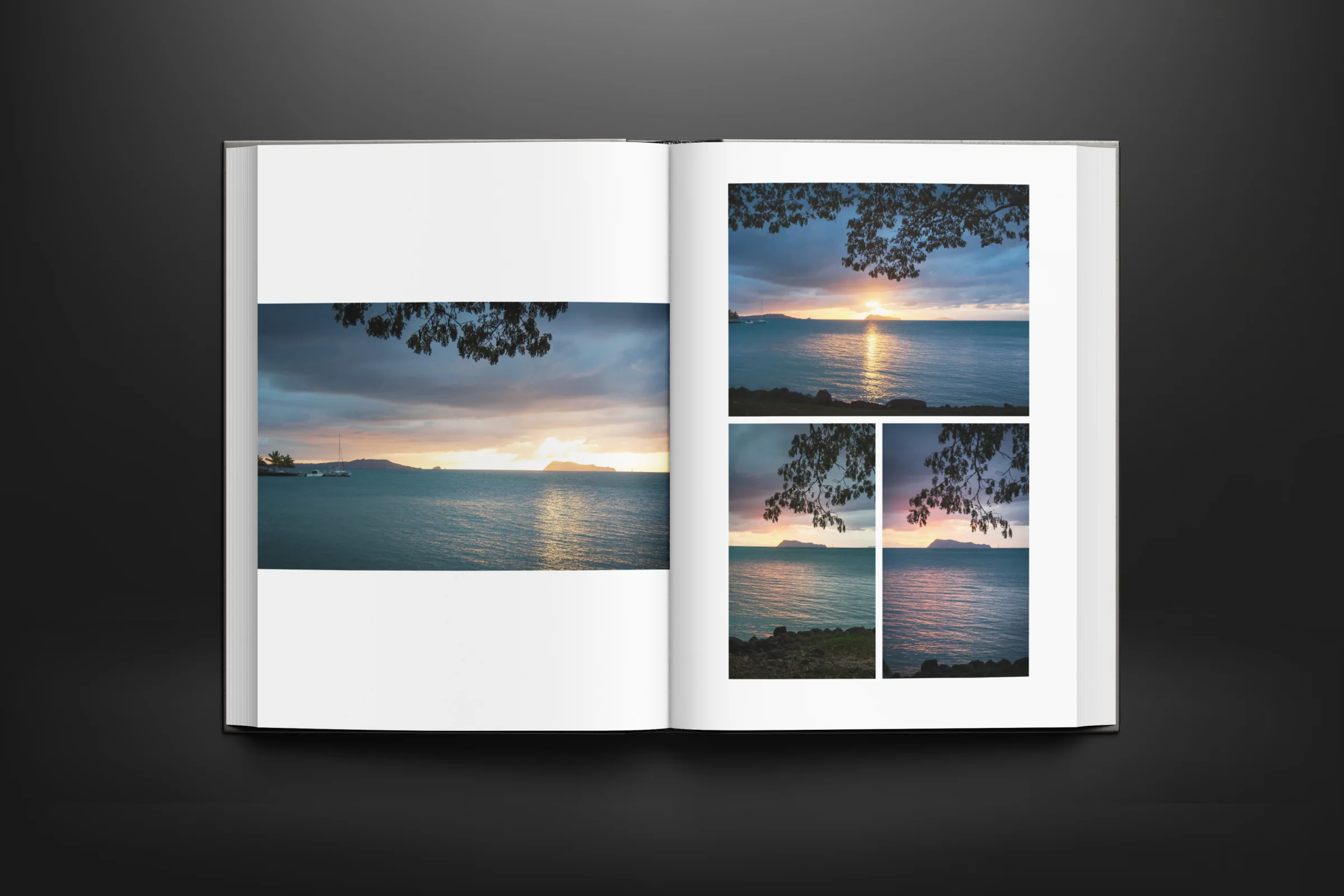 Open photo book showing a coastal sunset across its pages