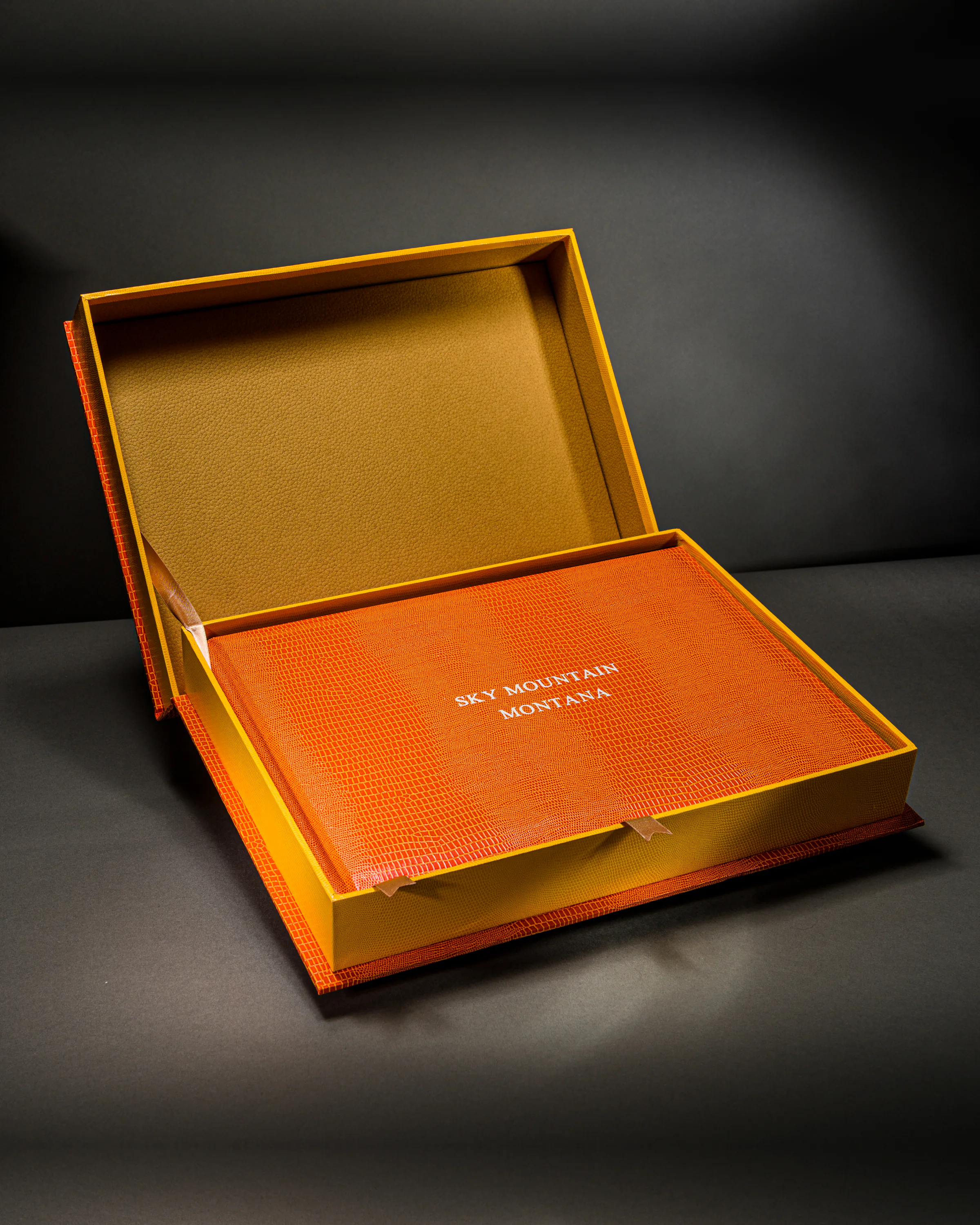 Orange Mount Athos travel book displayed in a gold-lined presentation box