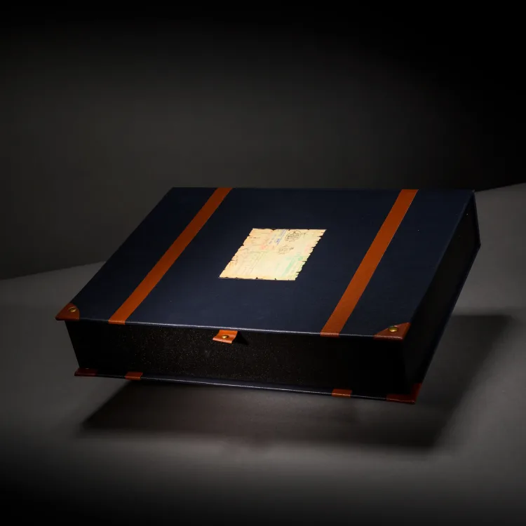 Navy travel portfolio box finished with orange straps and a vintage map inlay