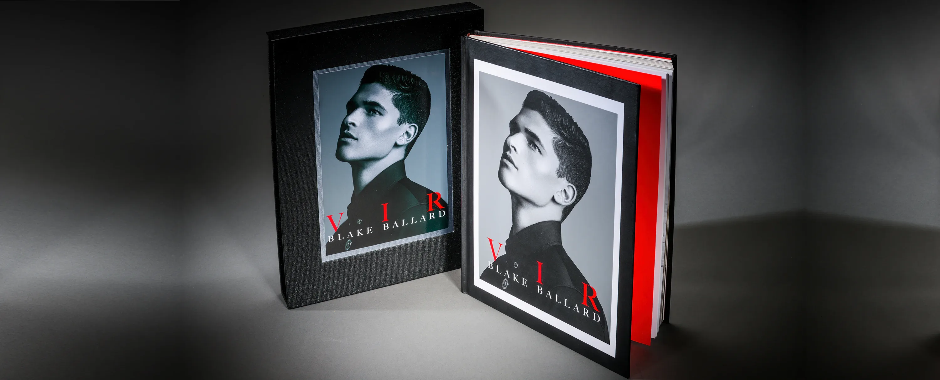 Black Blake Ballard portfolio book and matching presentation case with a red accent and monochrome portrait